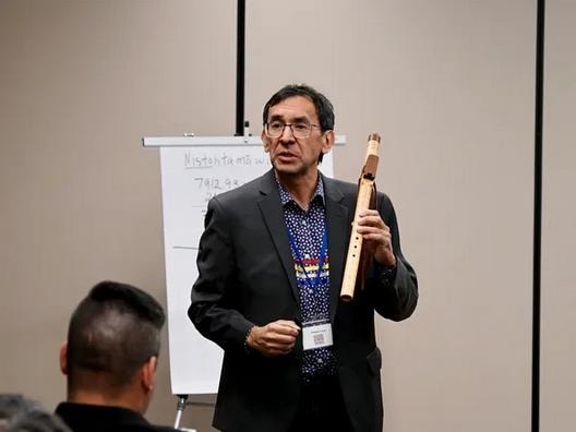 Speaker presenting at a Cree language roundtable discussion